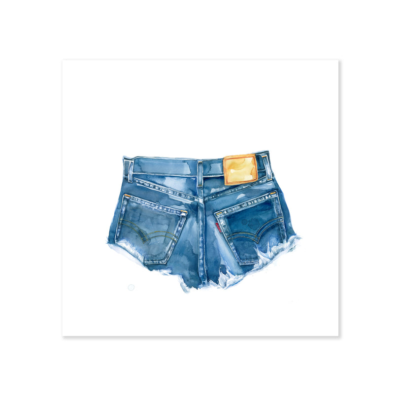 A fine art print illustrating a pair of levi's denim cutoff shorts with a frayed hem featuring a red tag painted with watercolors on a soft white background