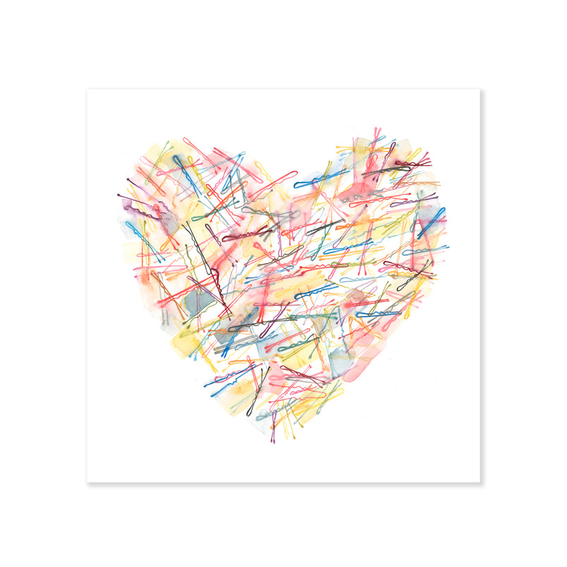A fine art print illustrating an array of blue purple red and orange hair pins laid out in the shape of a heart on a soft white background